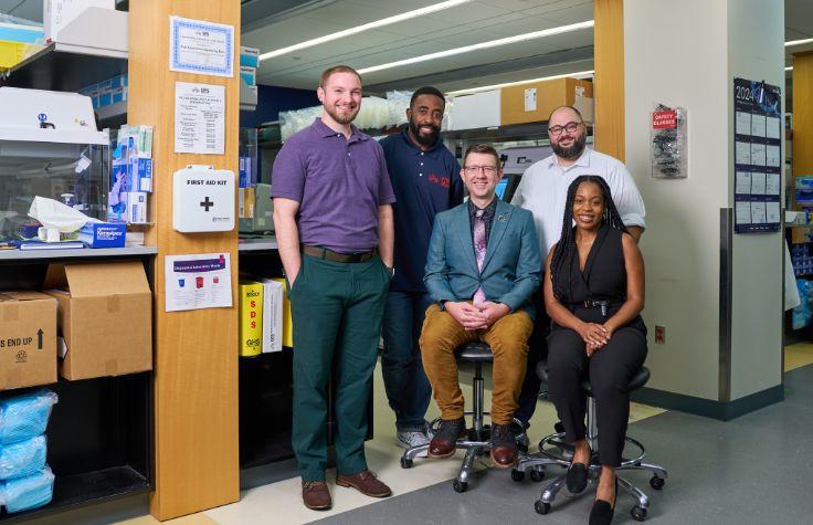 The NGS Core, from left to right: Dr. Joel Steyer, Bioinformatician; Ikenna Uzomah, Medical Technologist; Dr. Eric Vaughn, DrPH, NGS Supervisor; Wadih Bchara, Lead Sequencing Technologist; Taylor Boyd, Medical Technologist | Photo: Noah Willman