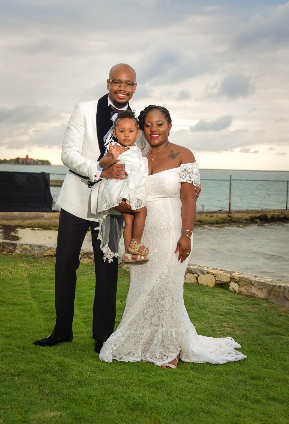 Dexter Thompson and family in wedding attire.