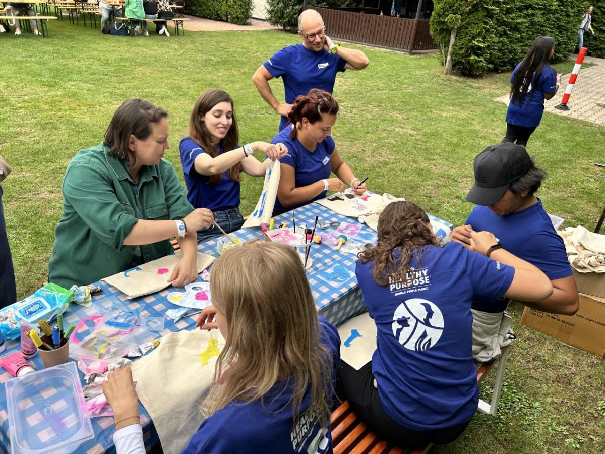 Elanco employees sitting at picnic table