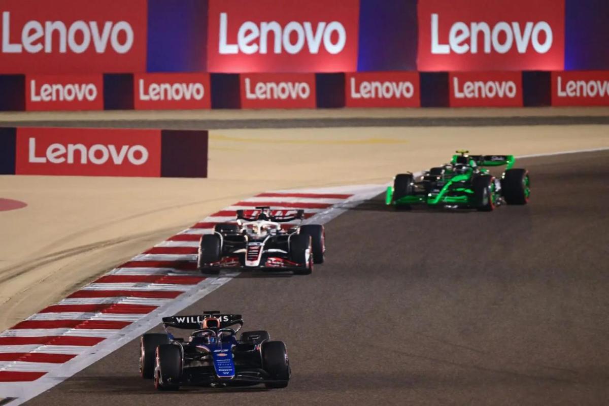 A F1 race. Lenovo banners on the boundaries.