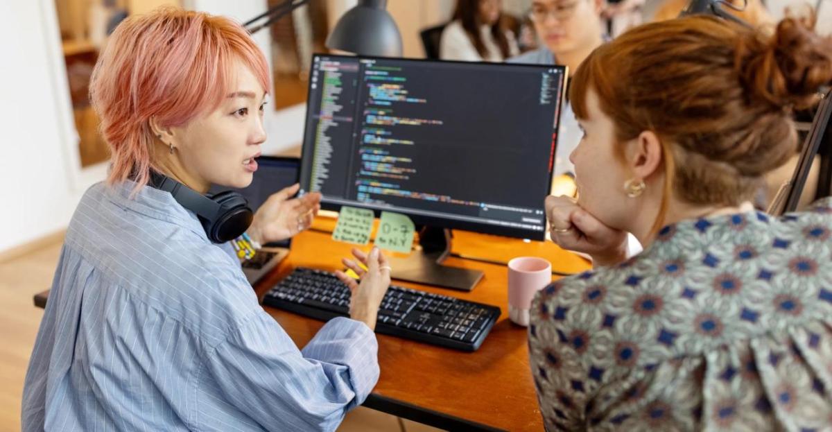 two women discussing cybersecurity