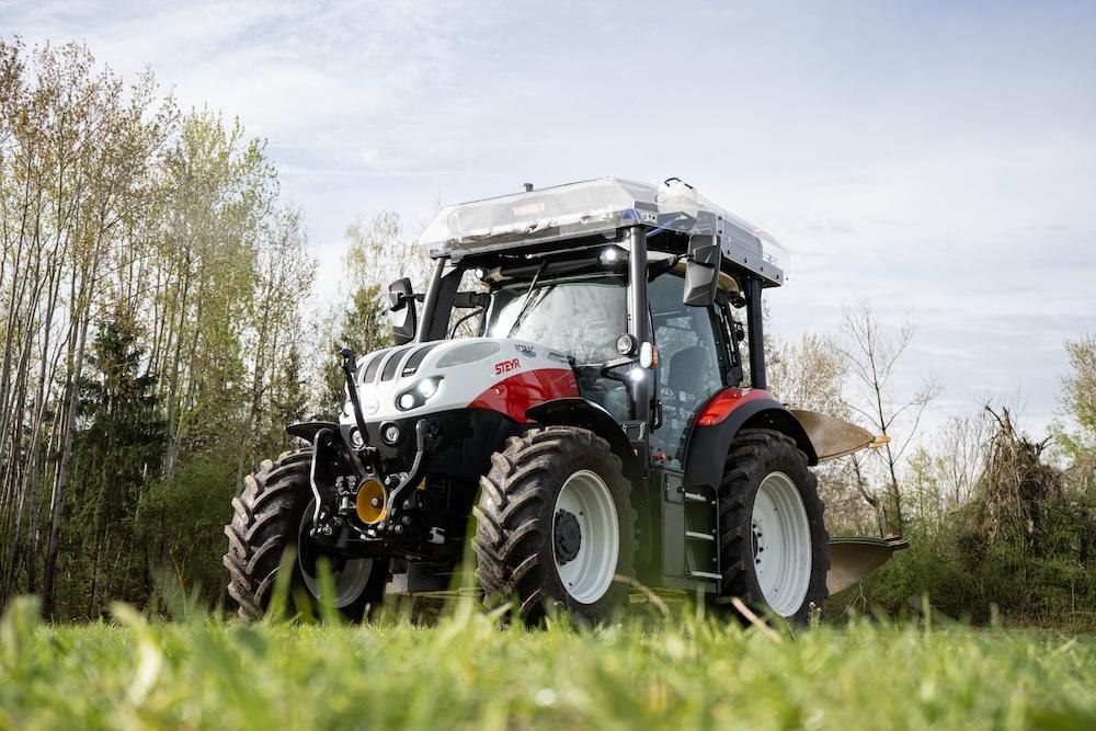 red tractor working in field