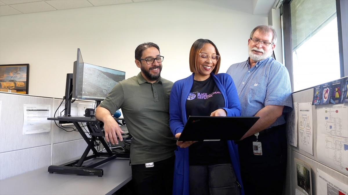 HARMAN Engineer Kelly with coworkers.