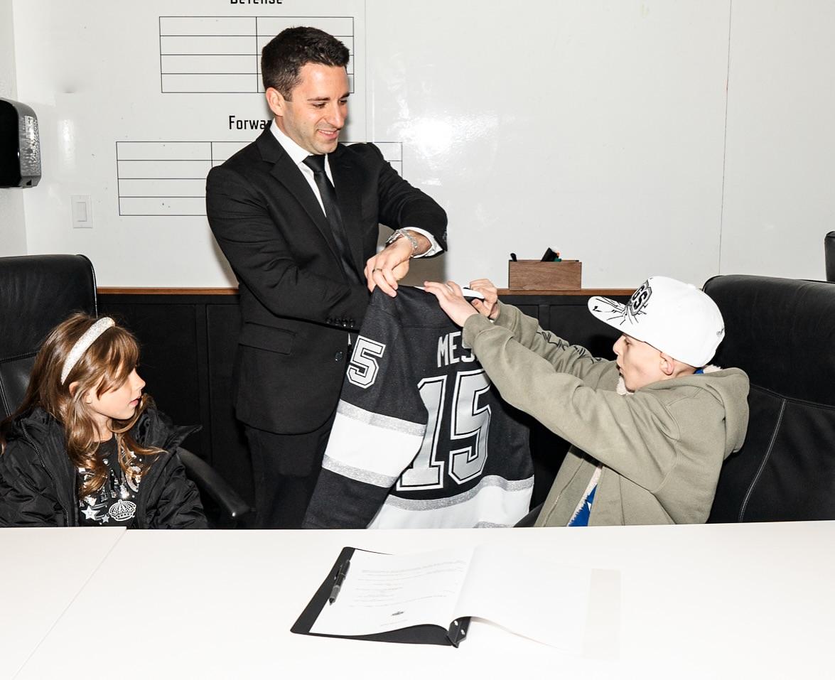 Joshua signed a special “contract” with Jake Goldberg, the LA Kings Senior Director of Hockey Operations.