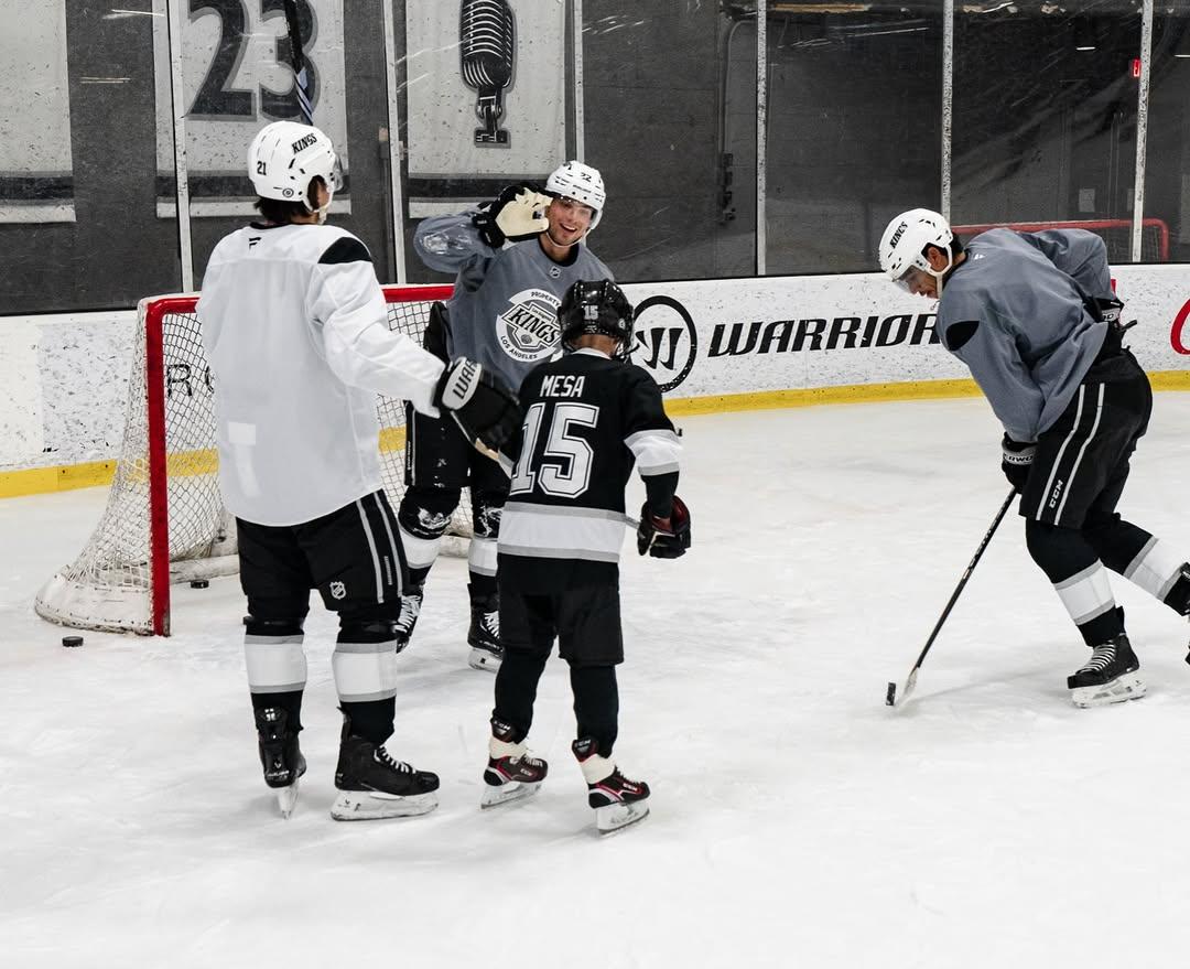 Joshua had the chance to step onto the ice to skate with the players after practice.