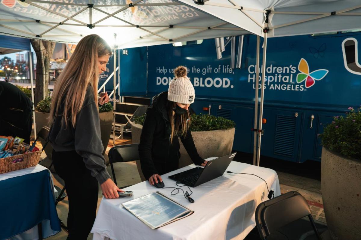 An LA Kings fan registers to donate blood outside of Crypto.com Arena prior to the LA Kings home game.