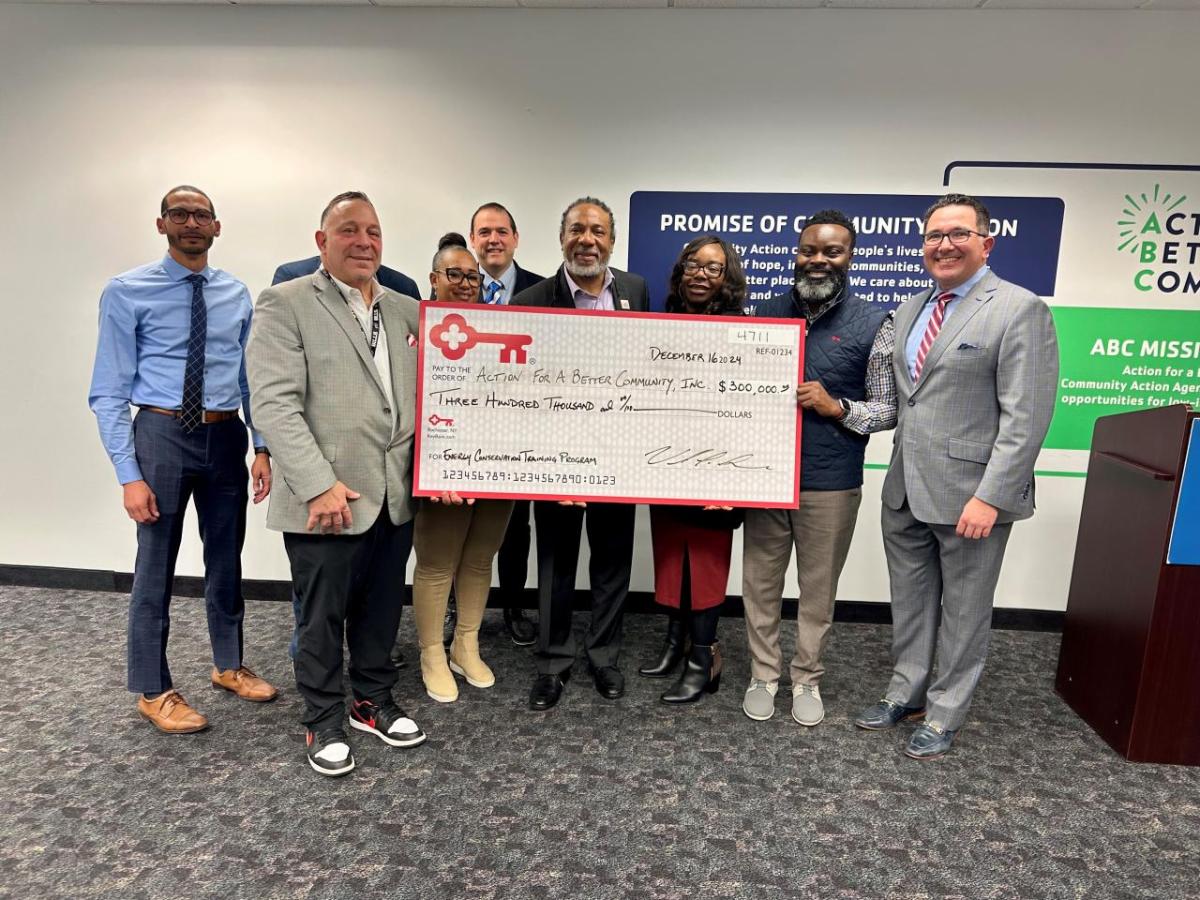 Representatives from The KeyBank Foundation and ABC Inc. shown with a  grant check for $300,000.