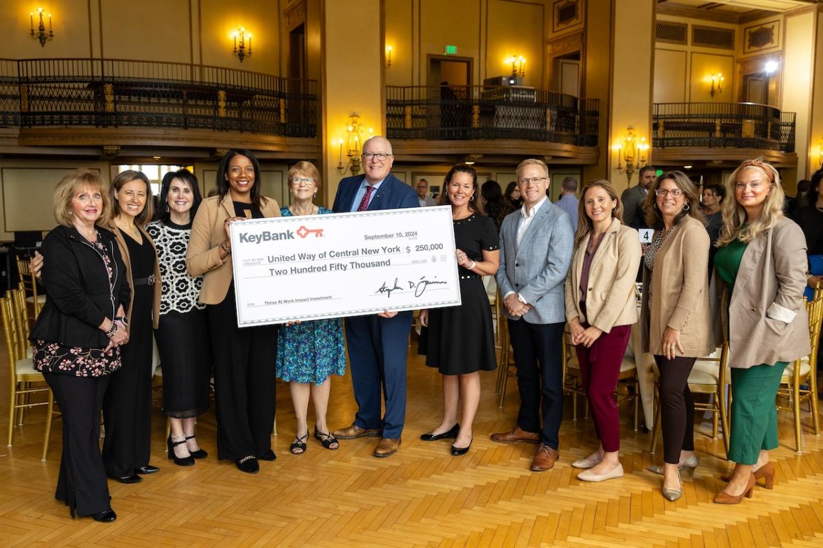 Representatives from KeyBank and United Way of Central New York shown with a grant check for $250,000.