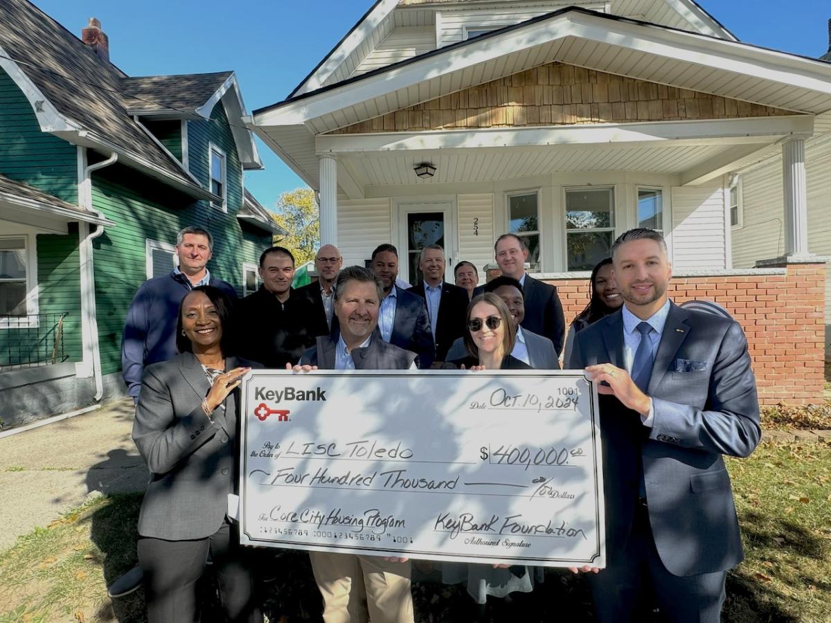 KeyBank and LISC Toledo representatives shown with a $400,000. grant check.