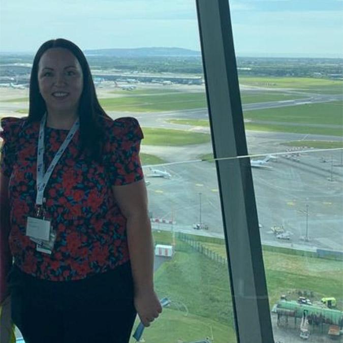 Leanne McGarry stood in front of an airport window 
