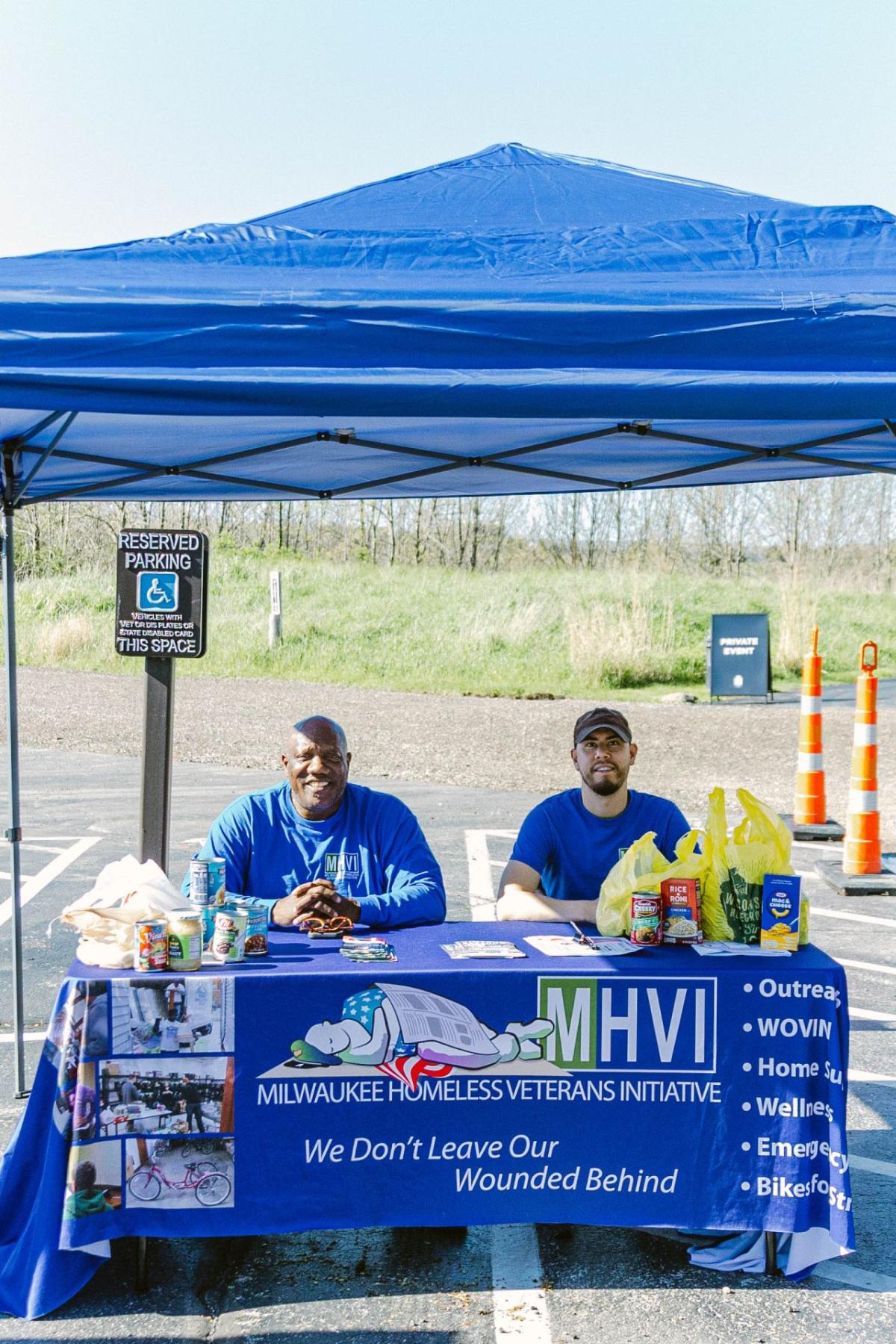 People seated at a booth "MHVI"