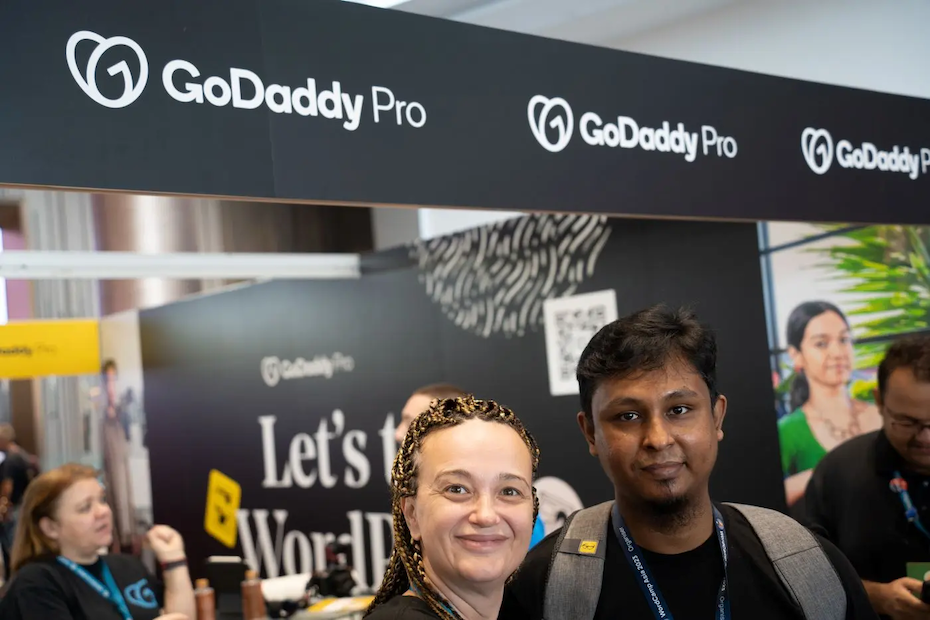 Maja shown at a GoDaddy Pro booth.