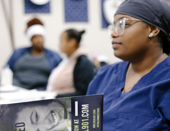 A medical professional holding a book