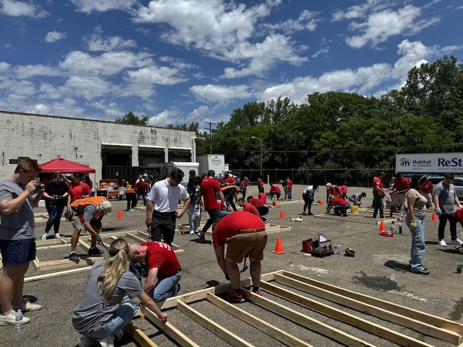 KeyBank volunteers shown building a frame for a home.