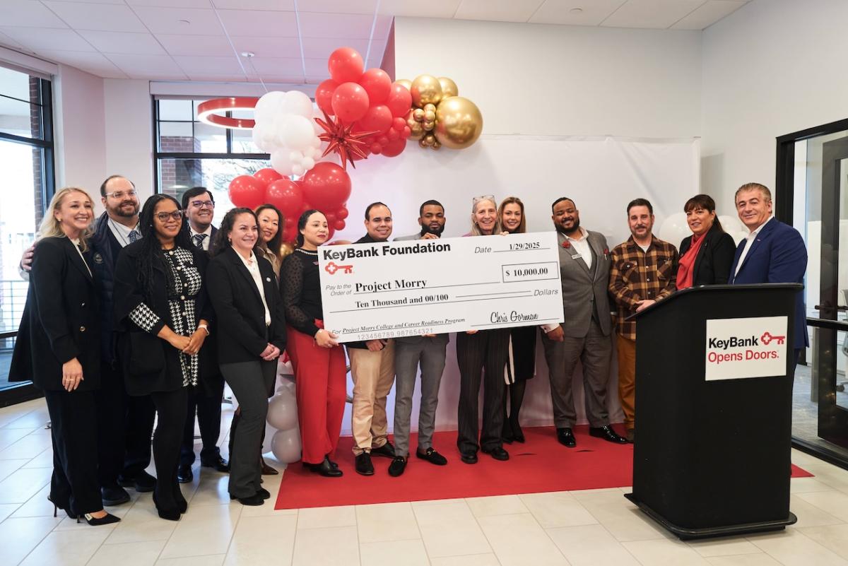 As part of the festivities, KeyBank presented a community grant to Dawn Ewing (center, 5th from right), Executive Director of Project Morry in Port Chester