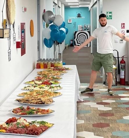 Paul shown at a celebration with a buffet.