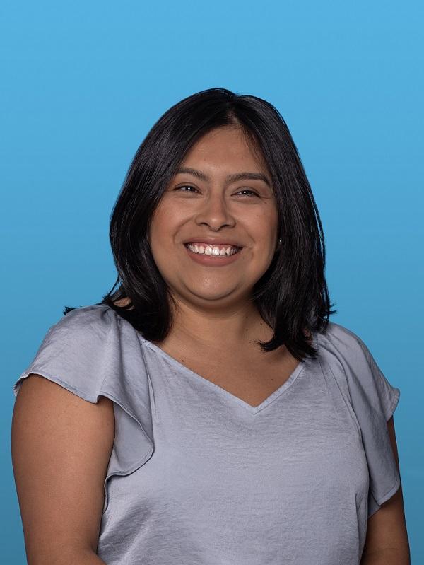 Headshot of Janet Perez against a blue background
