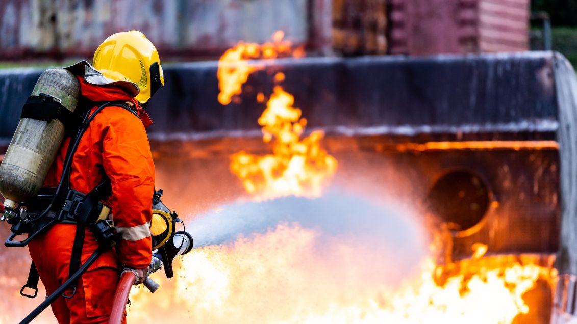 person putting out fire