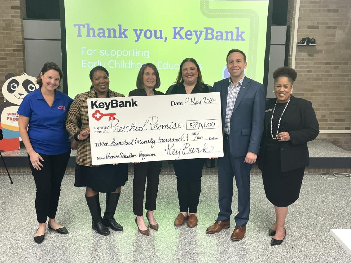 KeyBank and Preschool Promise Inc. representatives shown with a grant check for $390,000.