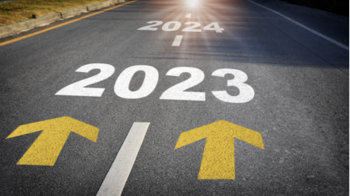 Road with arrows pointing from 2023 to 2024