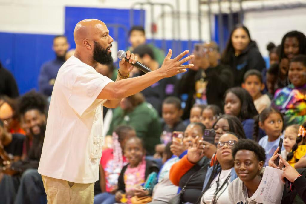 A person speaking in front of an audience 