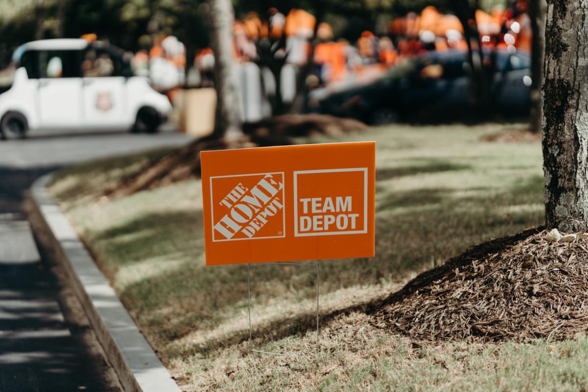 Sign showing The Home Depot and Team Depot.