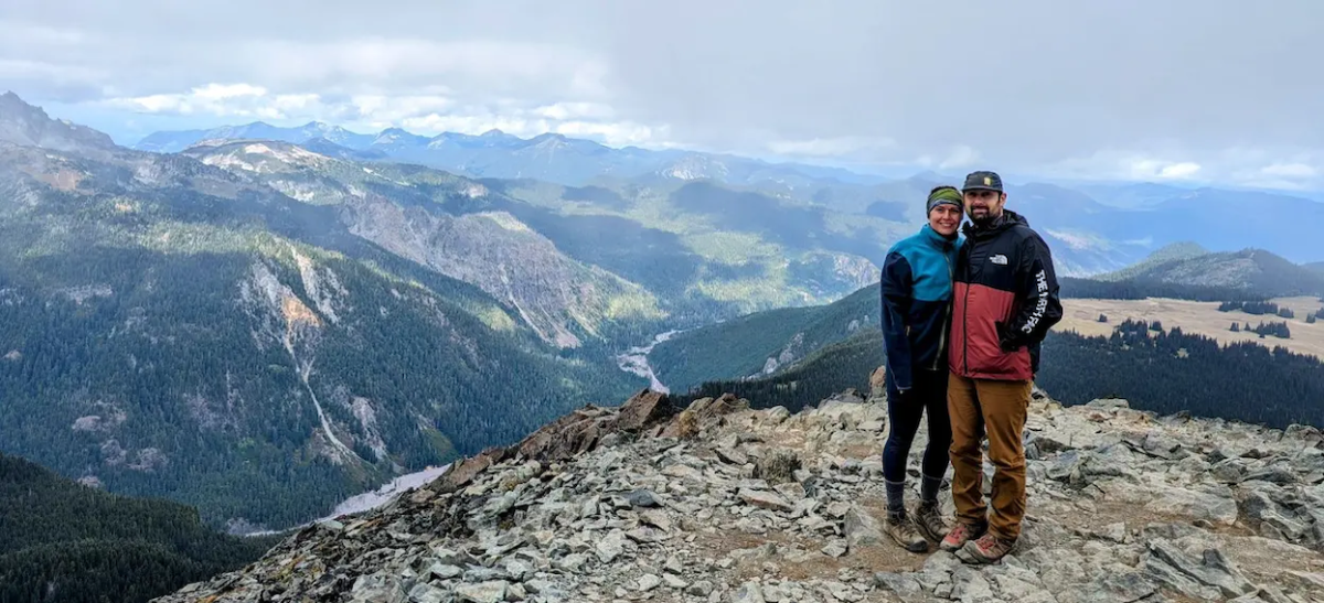 Tareyn Joseph on top of a mountain with her husband.