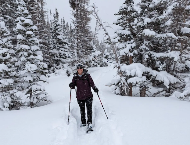 Tareyn snow-shoeing in a forest.