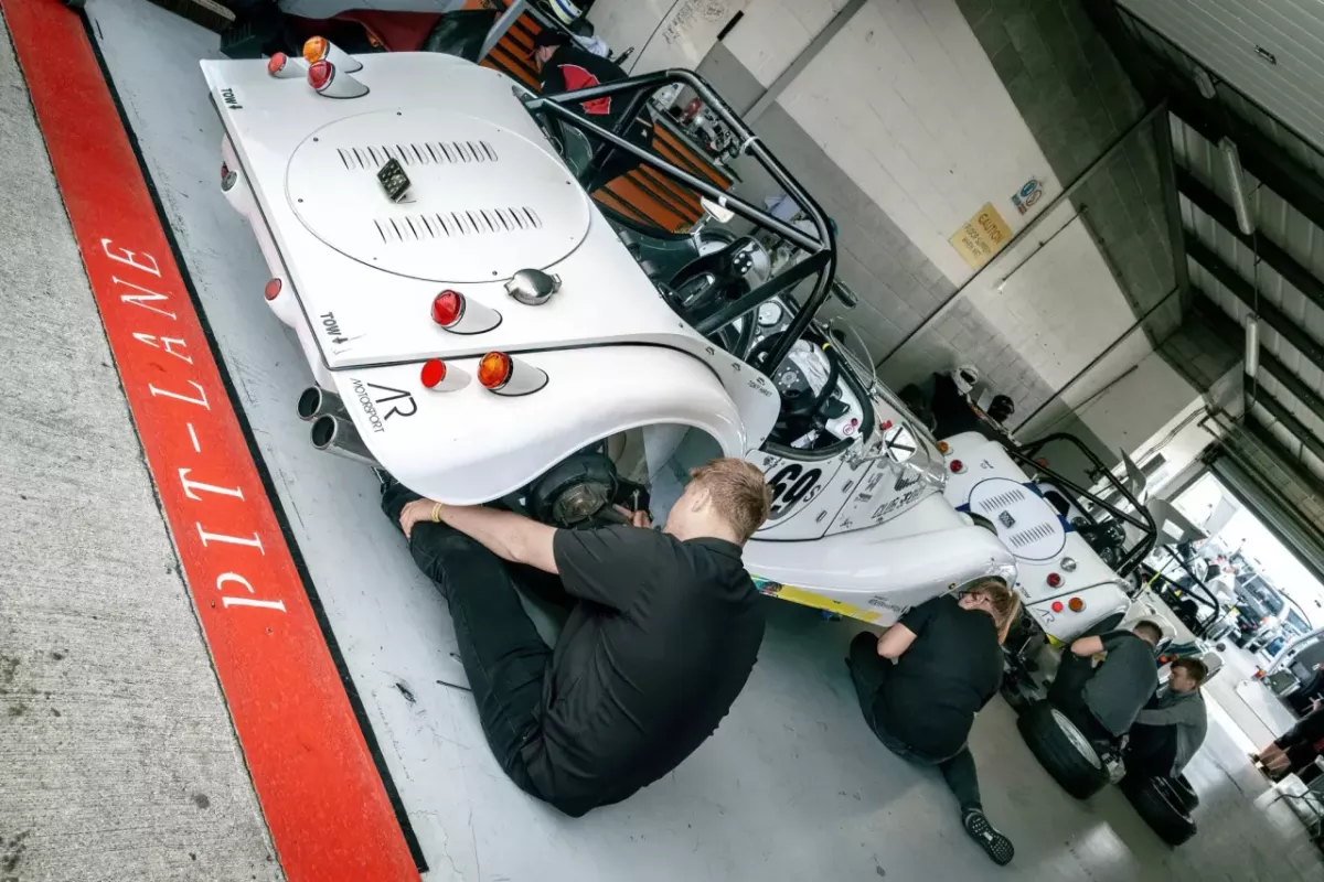 motorsport engineers working on a car