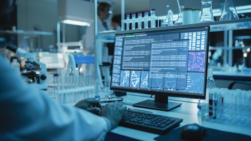 Person working at a desktop computer in lab