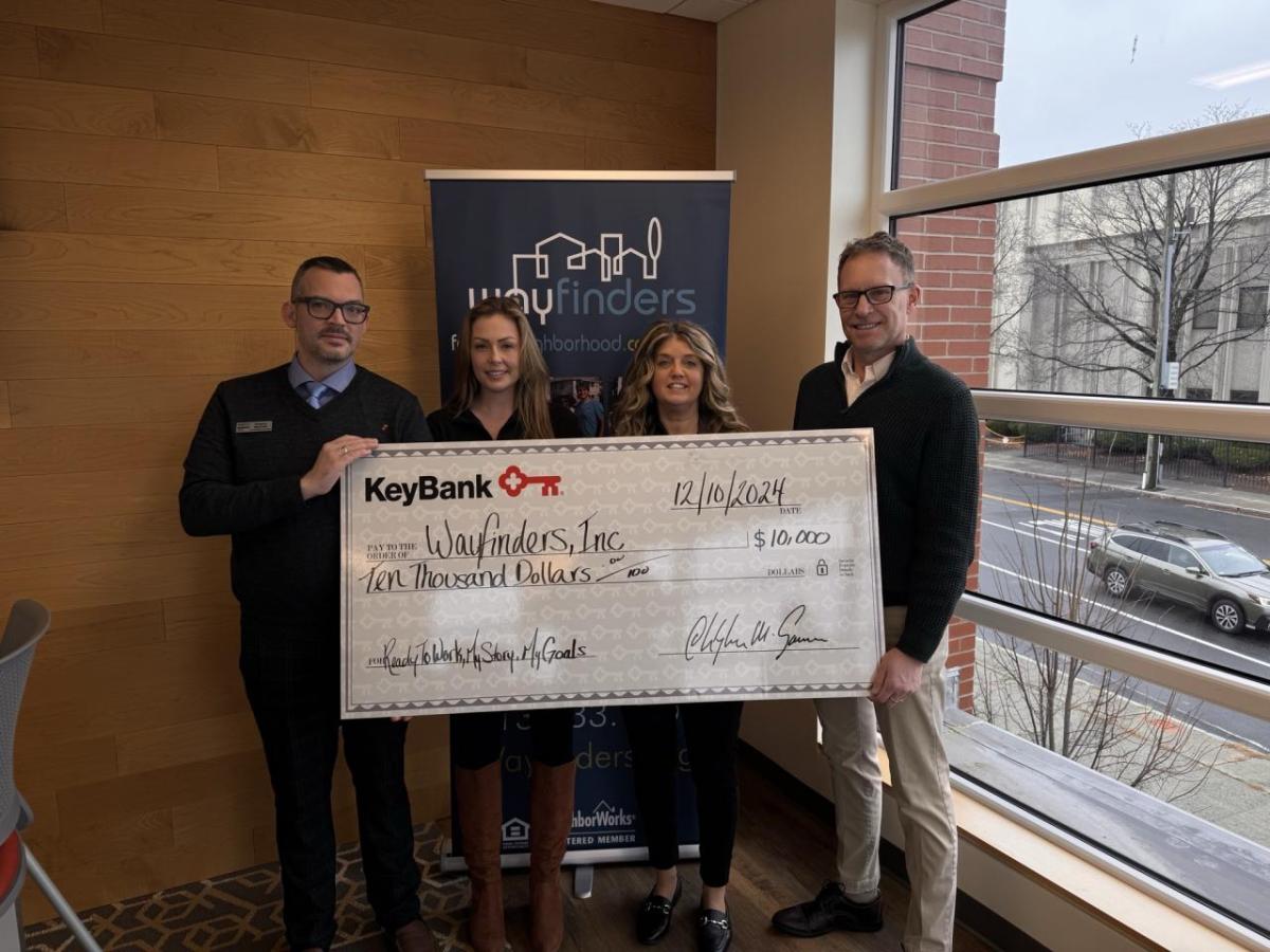 Photo caption: (from left) KeyBank leaders Greg Mularki, Branch Manager; Analisha Michanczyk, Corporate Responsibility Officer; and Tracy Menges,  Regional Community Sales Manager present a grant check to Way Finders Chief Development Officer John Bidwell.