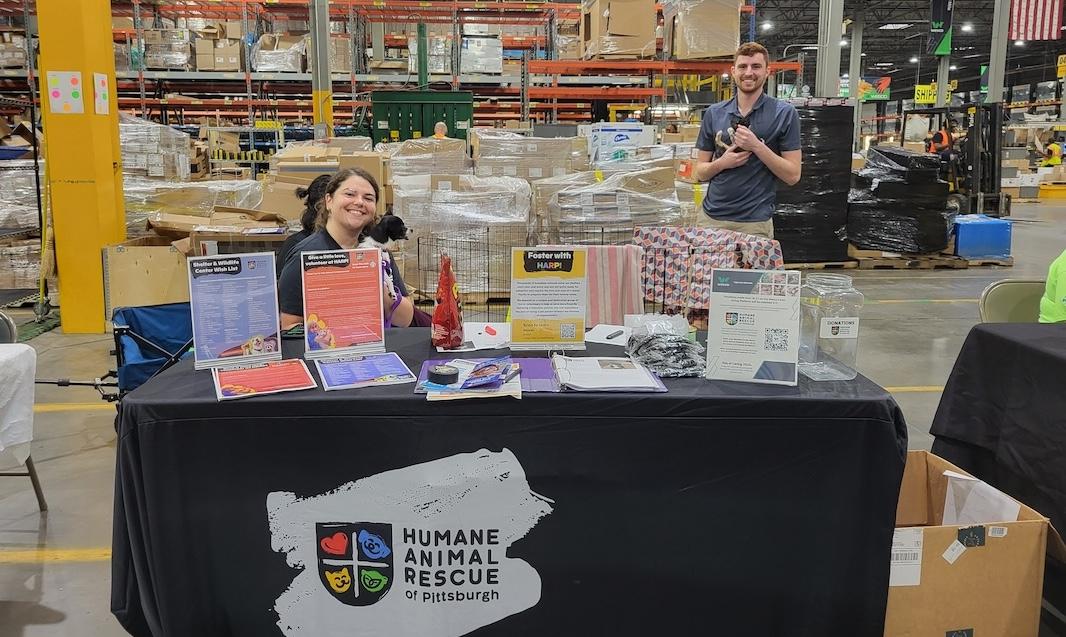 Humane Animal Rescue booth set up in the Wesco warehouse.