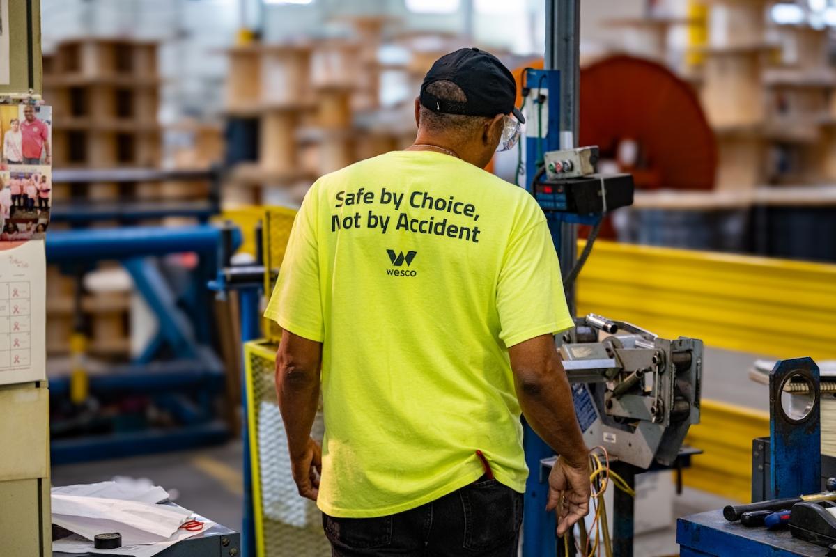 Wesco employee shown wearing a shirt that states: Safe by choice, not by accident.