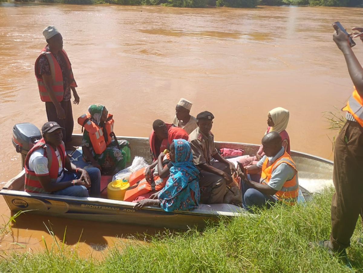 In Tana River, people use boats to travel on flooded roads.