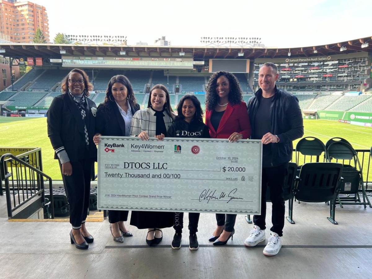 group holding up honorary check