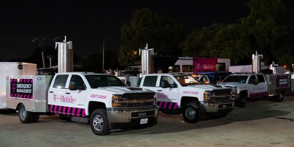 T-Mobile vehicles in parking lot