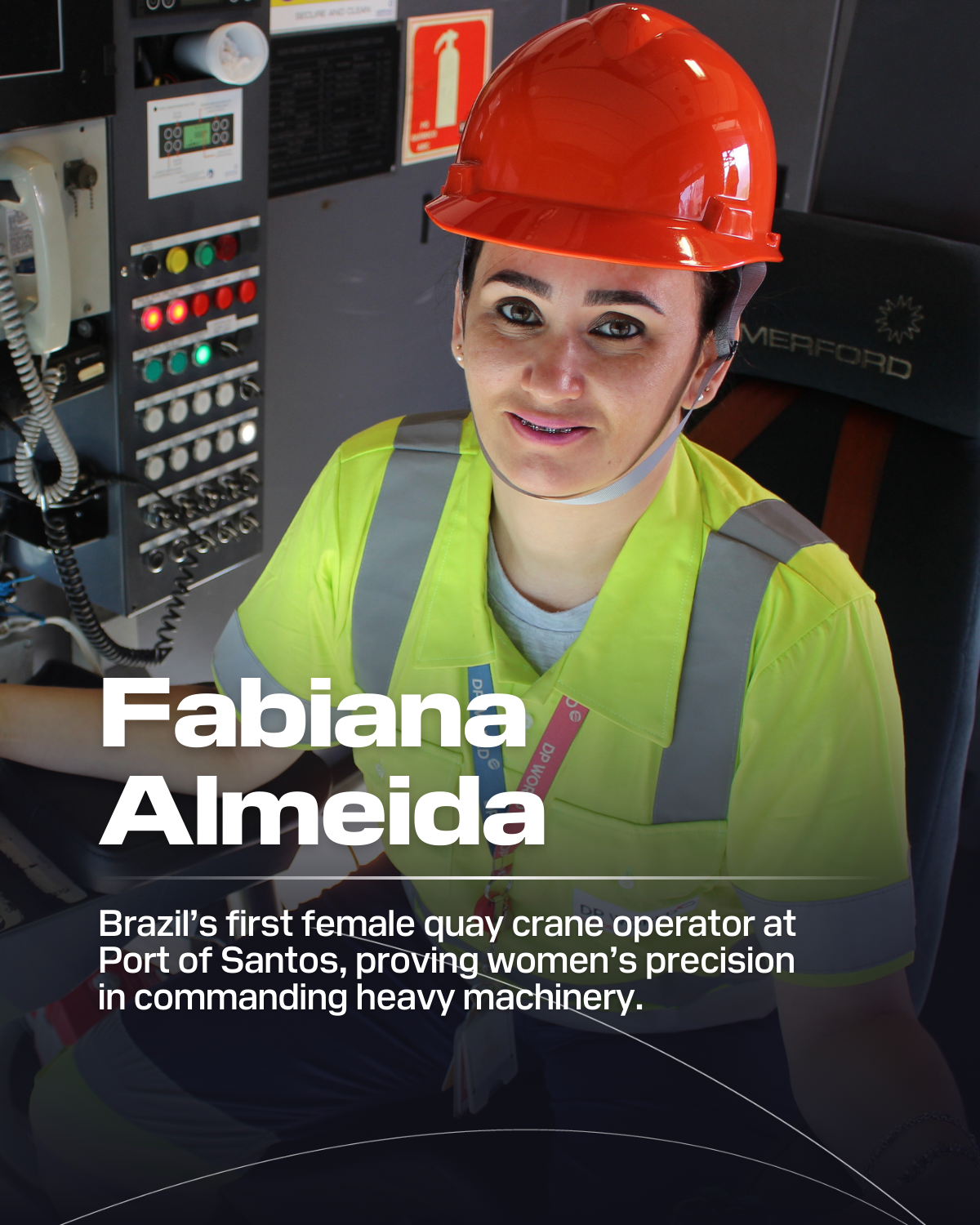 Fabiana Almeida wearing orange hardhat and yellow vest sitting by control panel and phone