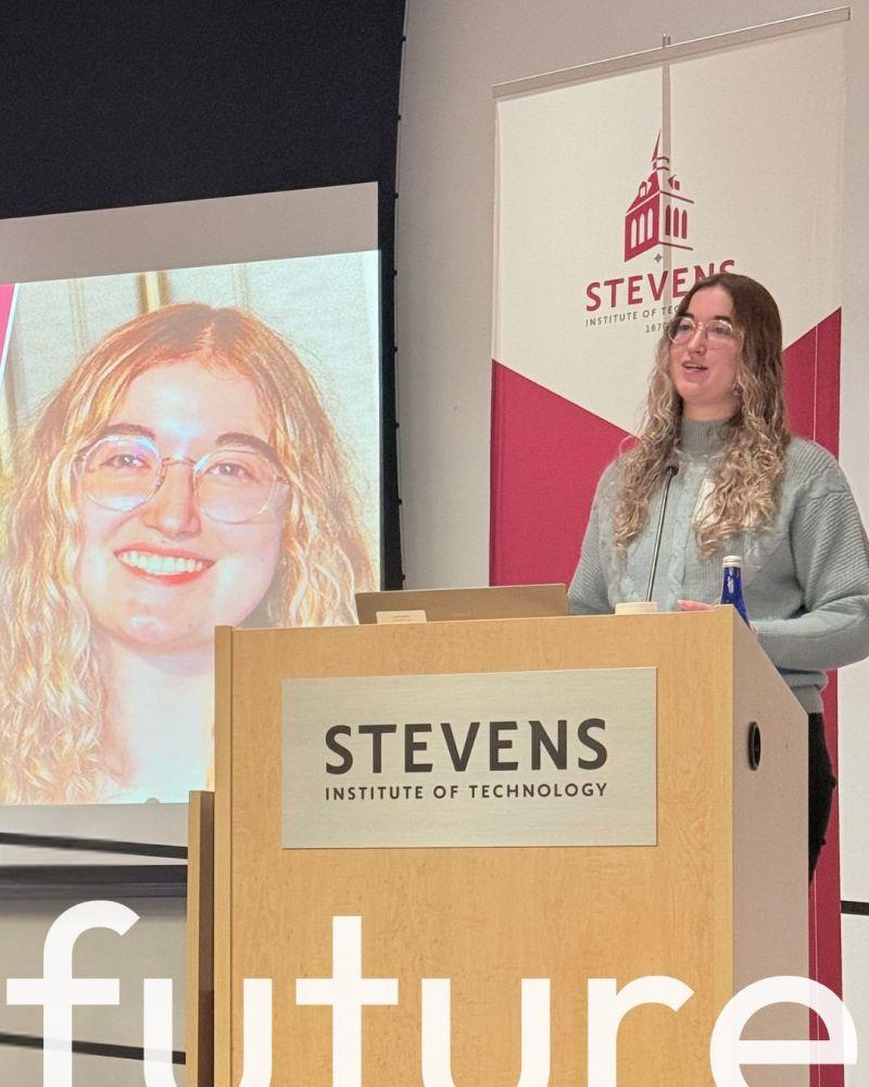 person speaking at a podium