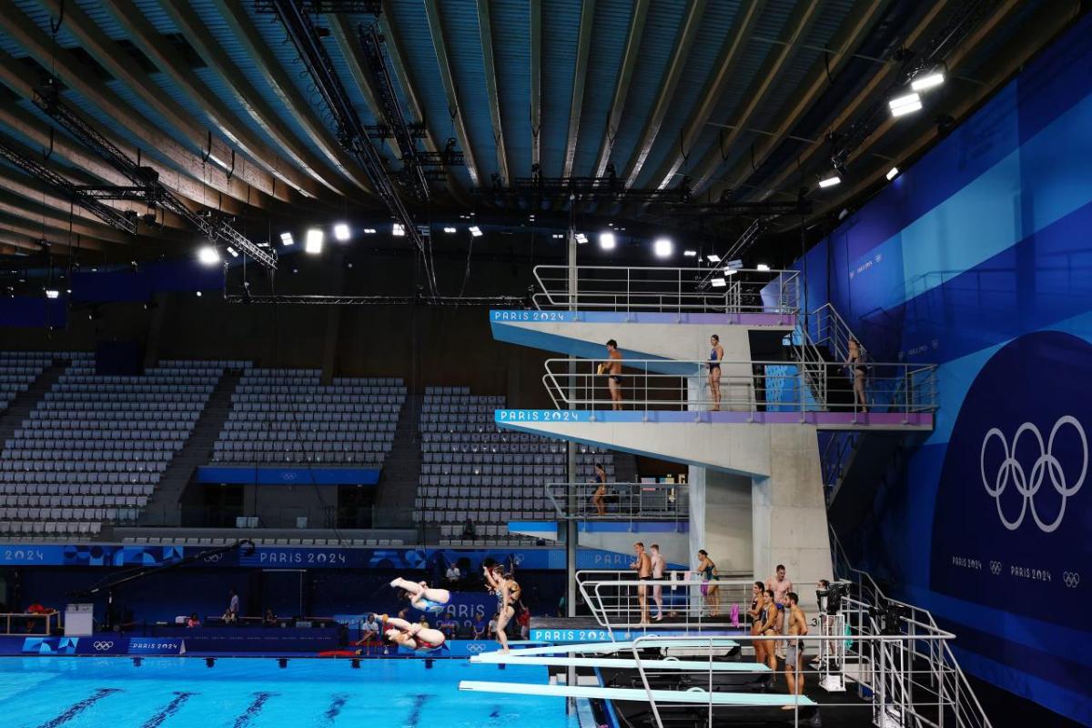 In an aquatic center with multiple-height diving boards.