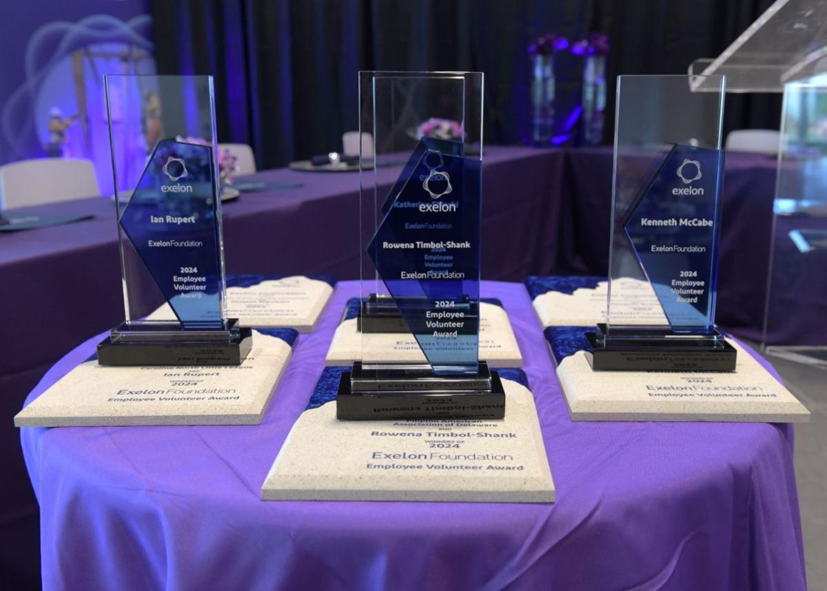 A table with six award trophies