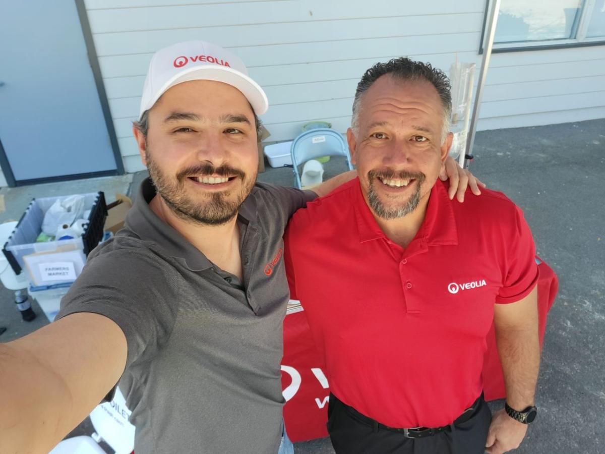 Two employees taking a 'selfie' at the event.