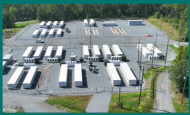 Aerial view of a paved lot with multiple storage trailers.