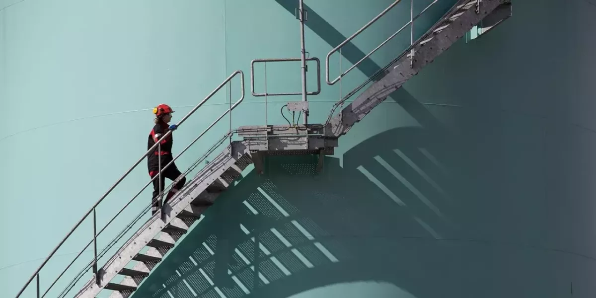 person walking up steps outside a building