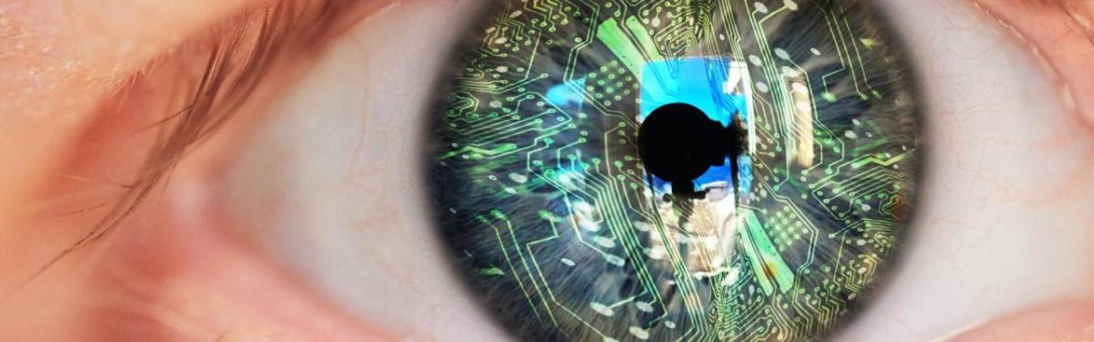 Close up of an eye. The iris overlaid with circuit board graphics.