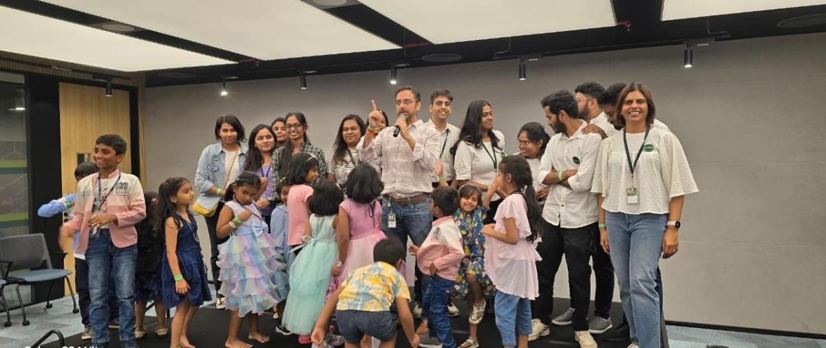 Employees and their children in an office