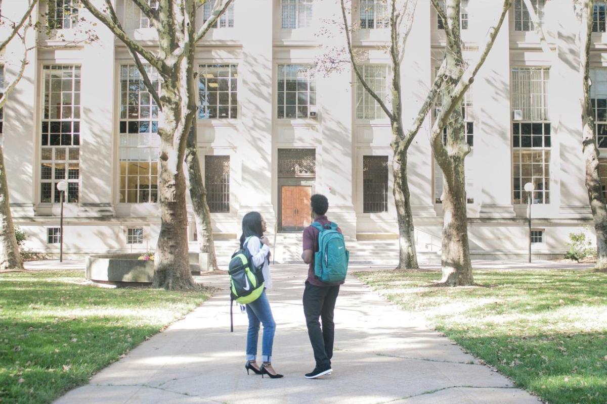 people walking on a college campus