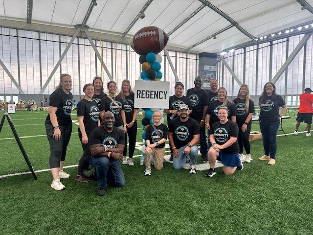 Volunteers posed in an indoor stadium