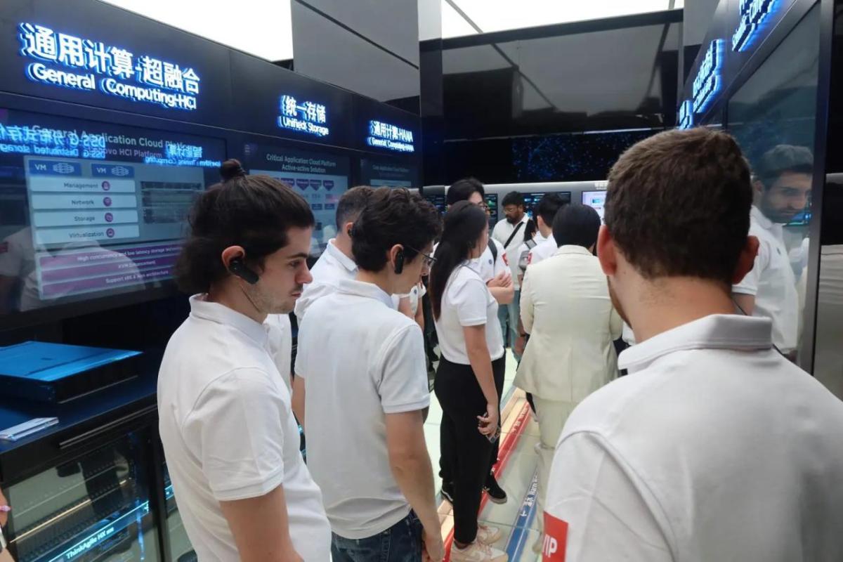 People in matching shirts walking through a display area