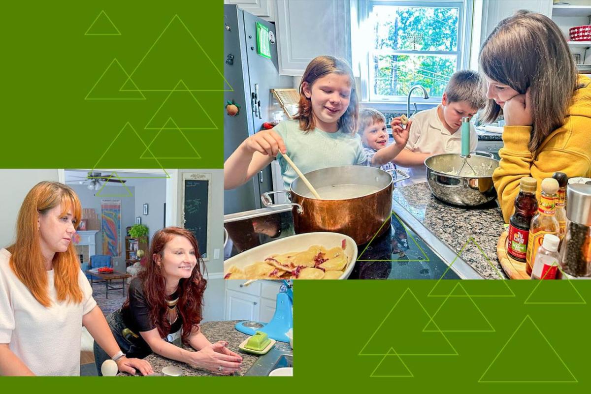 The Sviatyi family and host family cooking in a kitchen.