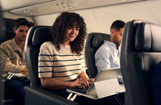 People seated on an airplane.